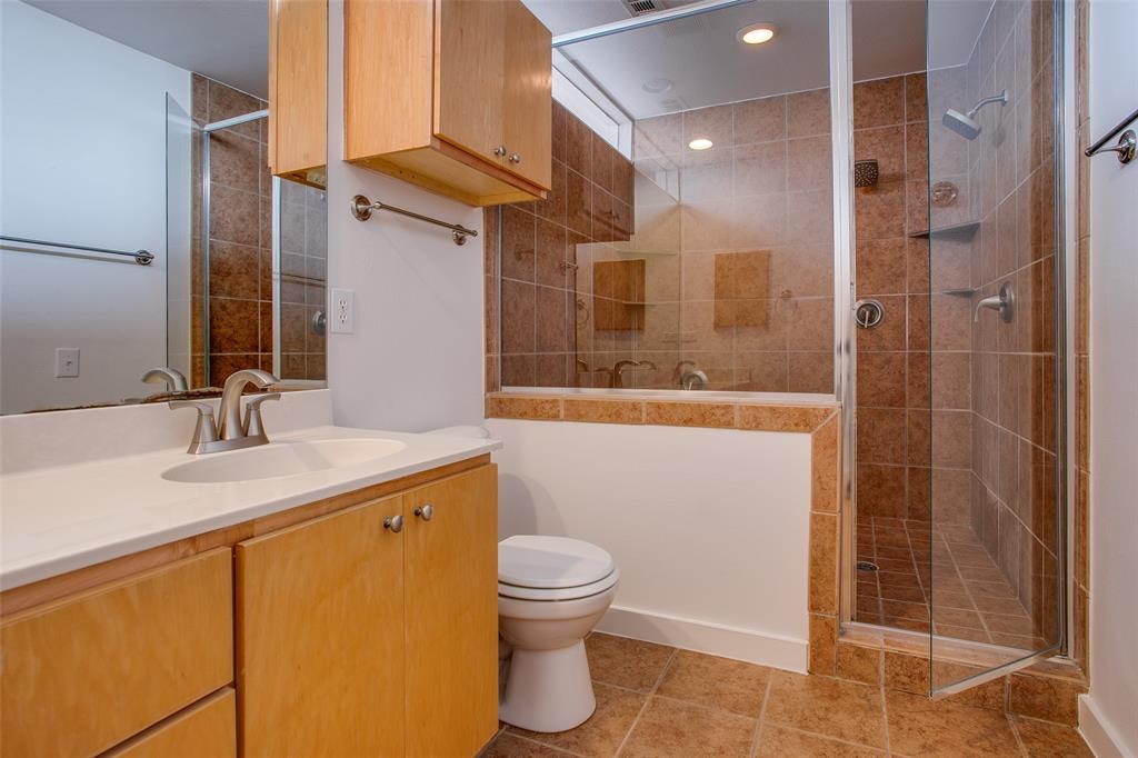3840 San Jacinto Street Dallas, TX 75204 - Photo 24 of 34 a bathroom with a sink a toilet and shower
