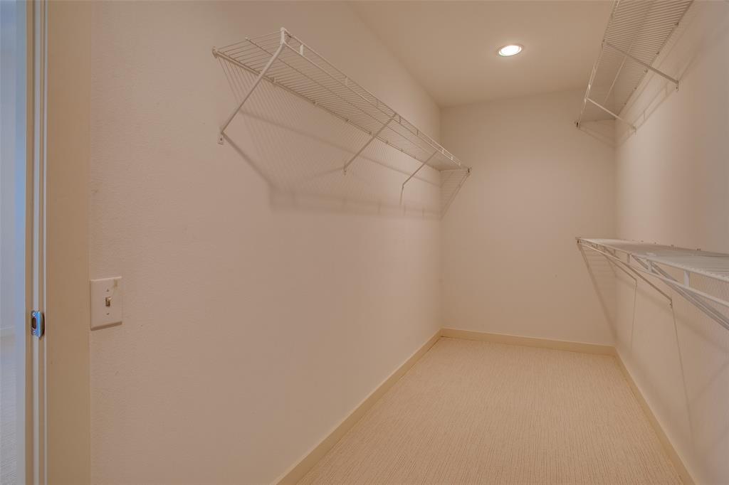 3840 San Jacinto Street Dallas, TX 75204 - Photo 26 of 34 a view of a room with racks on the wall