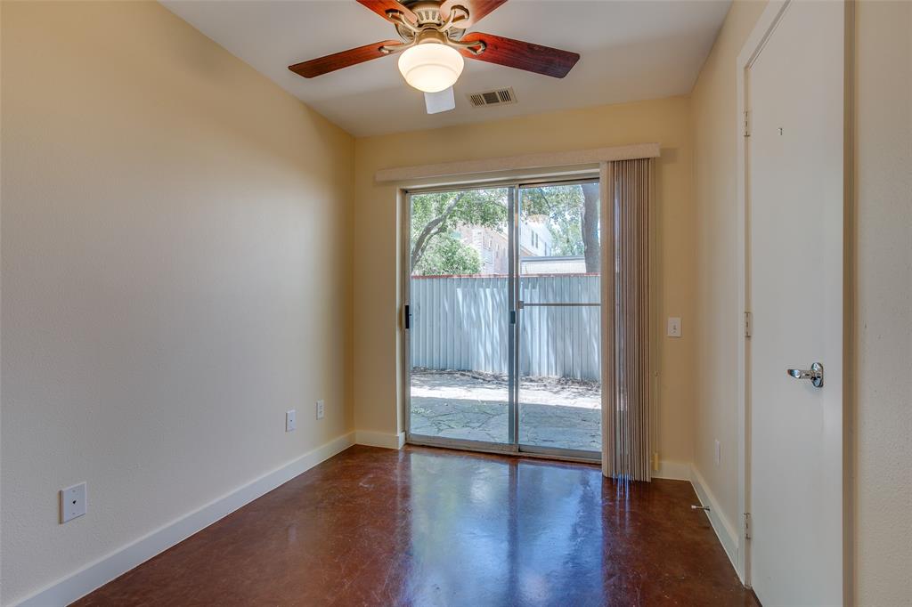 3840 San Jacinto Street Dallas, TX 75204 - Photo 27 of 34 an empty room with wooden floor fan and windows