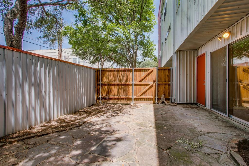 3840 San Jacinto Street Dallas, TX 75204 - Photo 31 of 34 a view of a backyard with wooden fence