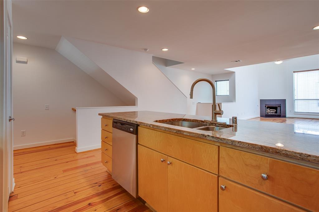 3840 San Jacinto Street Dallas, TX 75204 - Photo 10 of 34 a kitchen with granite countertop a stove and a sink