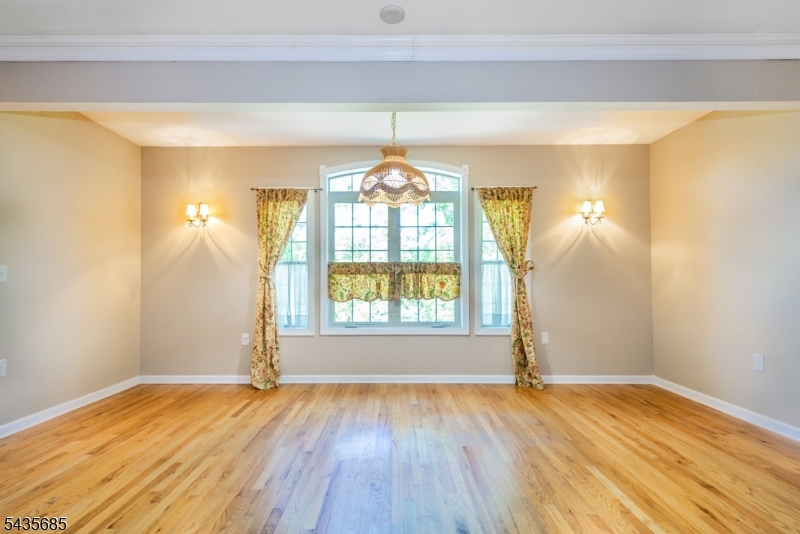 16 Main Street Sparta, NJ 07871 - Photo 13 of 33 a view of empty room with wooden floor and fan