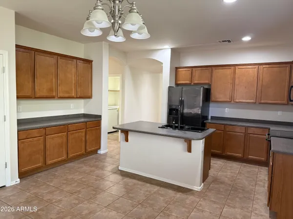 a kitchen with stainless steel appliances granite countertop a stove and a sink with granite countertops