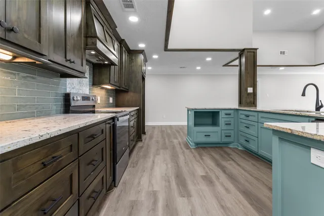 an aerial view of a houses with a yard