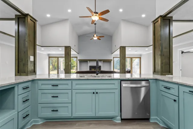 a kitchen with cabinets and window
