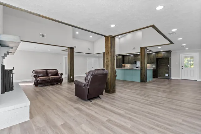 a house that has a tree in front of it