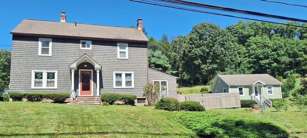 a view of a house with a yard