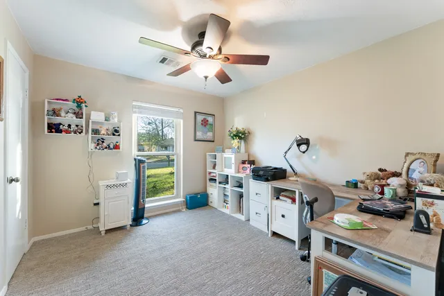 a view of a workspace with furniture