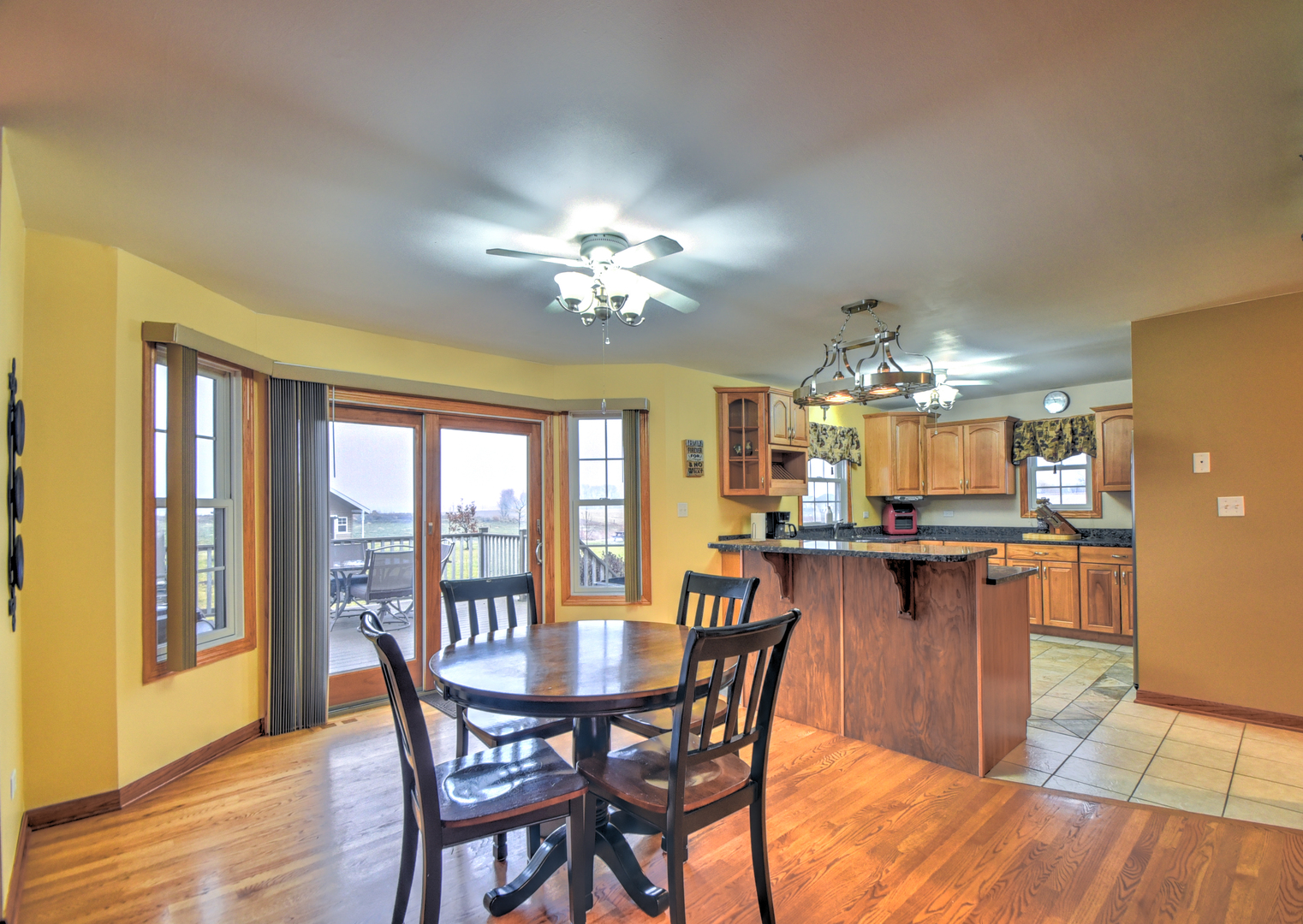 16045 Stateline Road Cedar Lake, IN 46303 - Photo 16 of 36 a view of a dining room with furniture window and wooden floor
