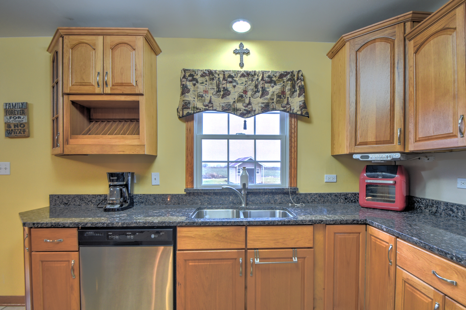 16045 Stateline Road Cedar Lake, IN 46303 - Photo 19 of 36 a kitchen with granite countertop a sink stainless steel appliances white cabinets and a window