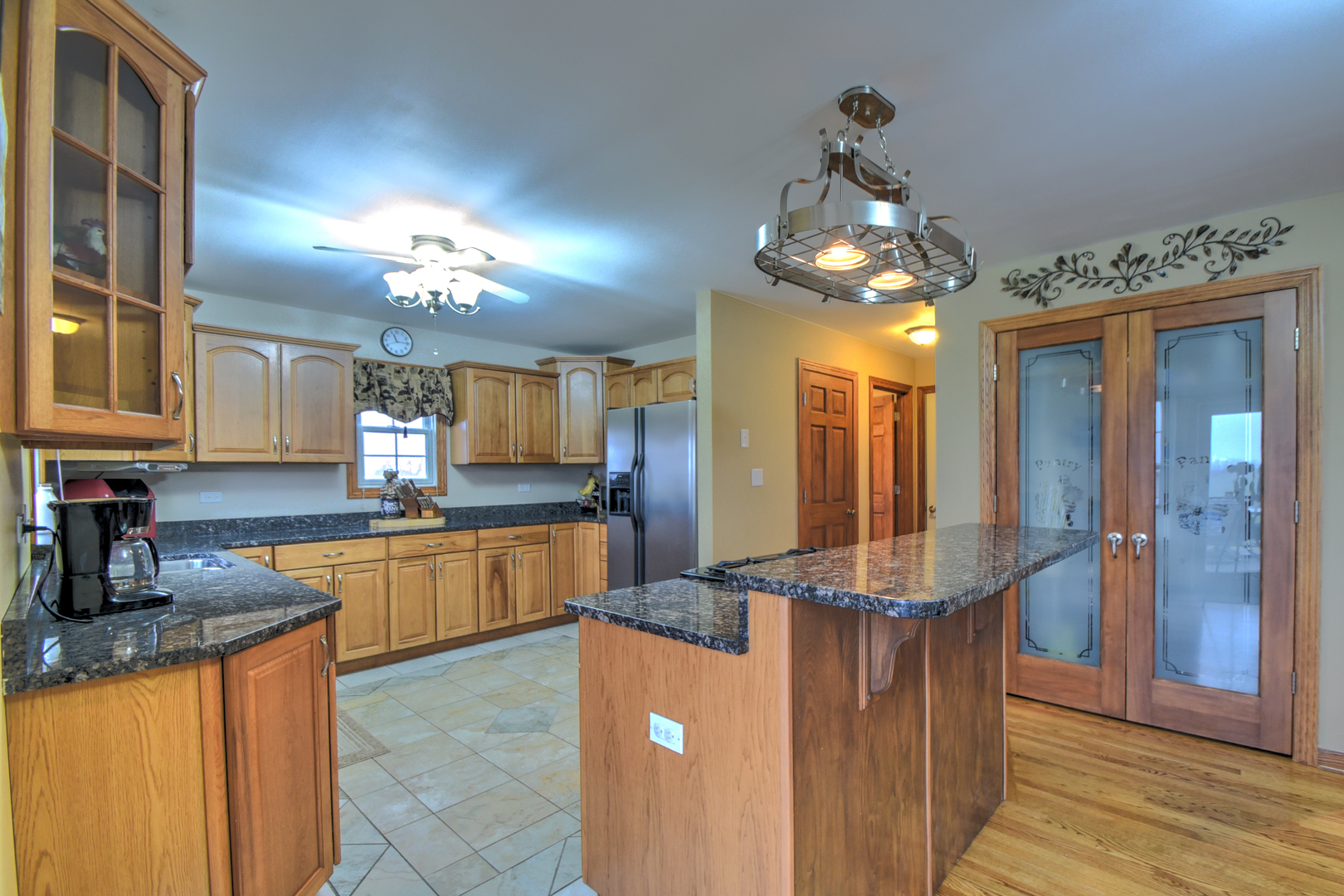 16045 Stateline Road Cedar Lake, IN 46303 - Photo 22 of 36 a kitchen with granite countertop a refrigerator and a sink