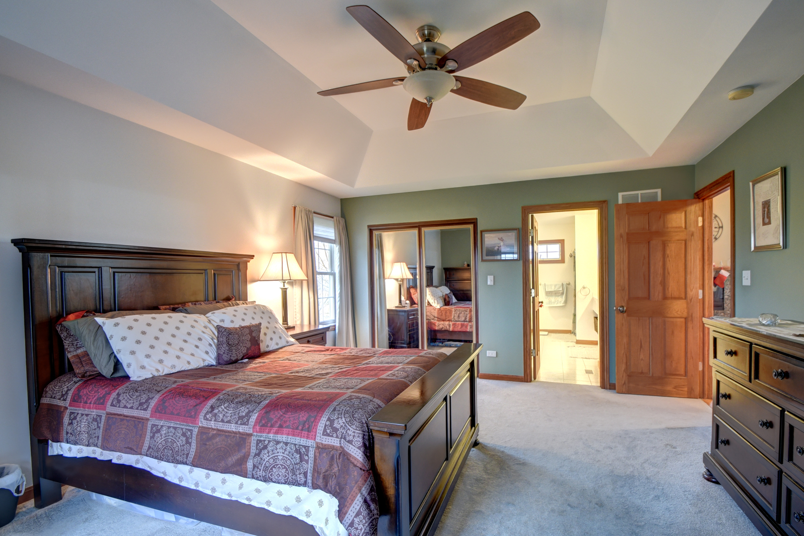 16045 Stateline Road Cedar Lake, IN 46303 - Photo 24 of 36 a bedroom with a large bed and a chandelier