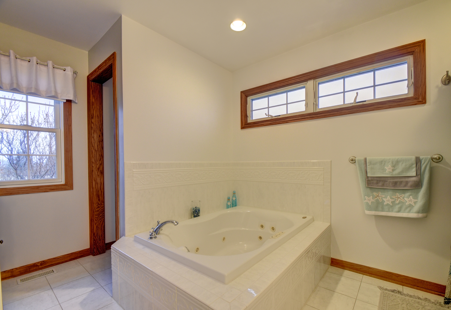 16045 Stateline Road Cedar Lake, IN 46303 - Photo 27 of 36 a bathroom with a tub a sink and a window
