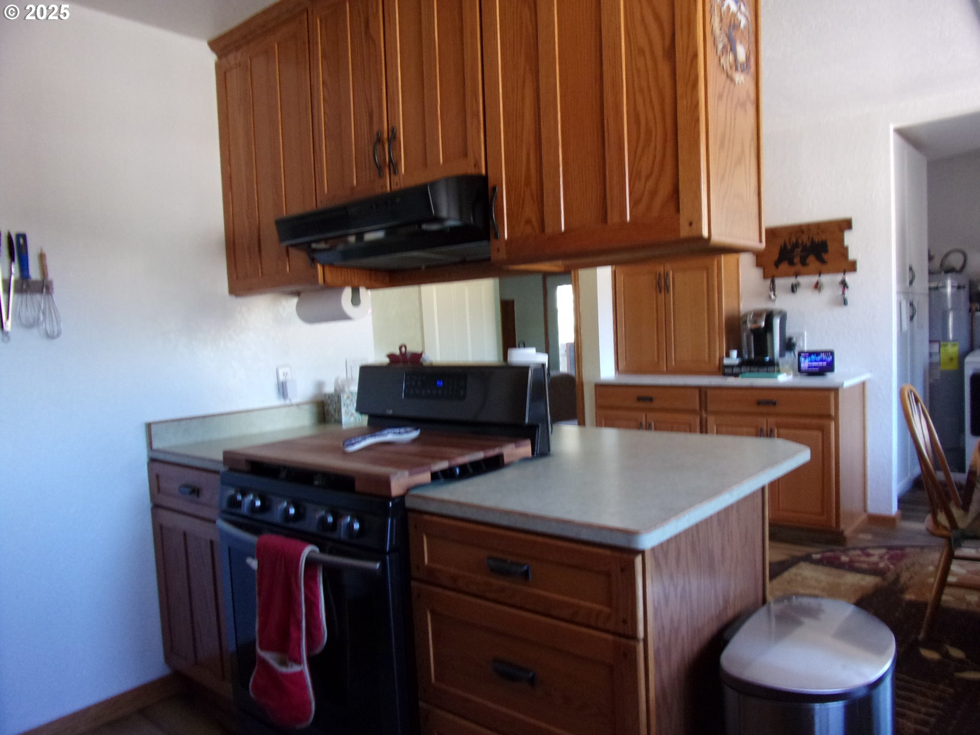 375 Jordan Creek Road Riddle, OR 97469 - Photo 23 of 35 a kitchen with a stove a sink and a refrigerator