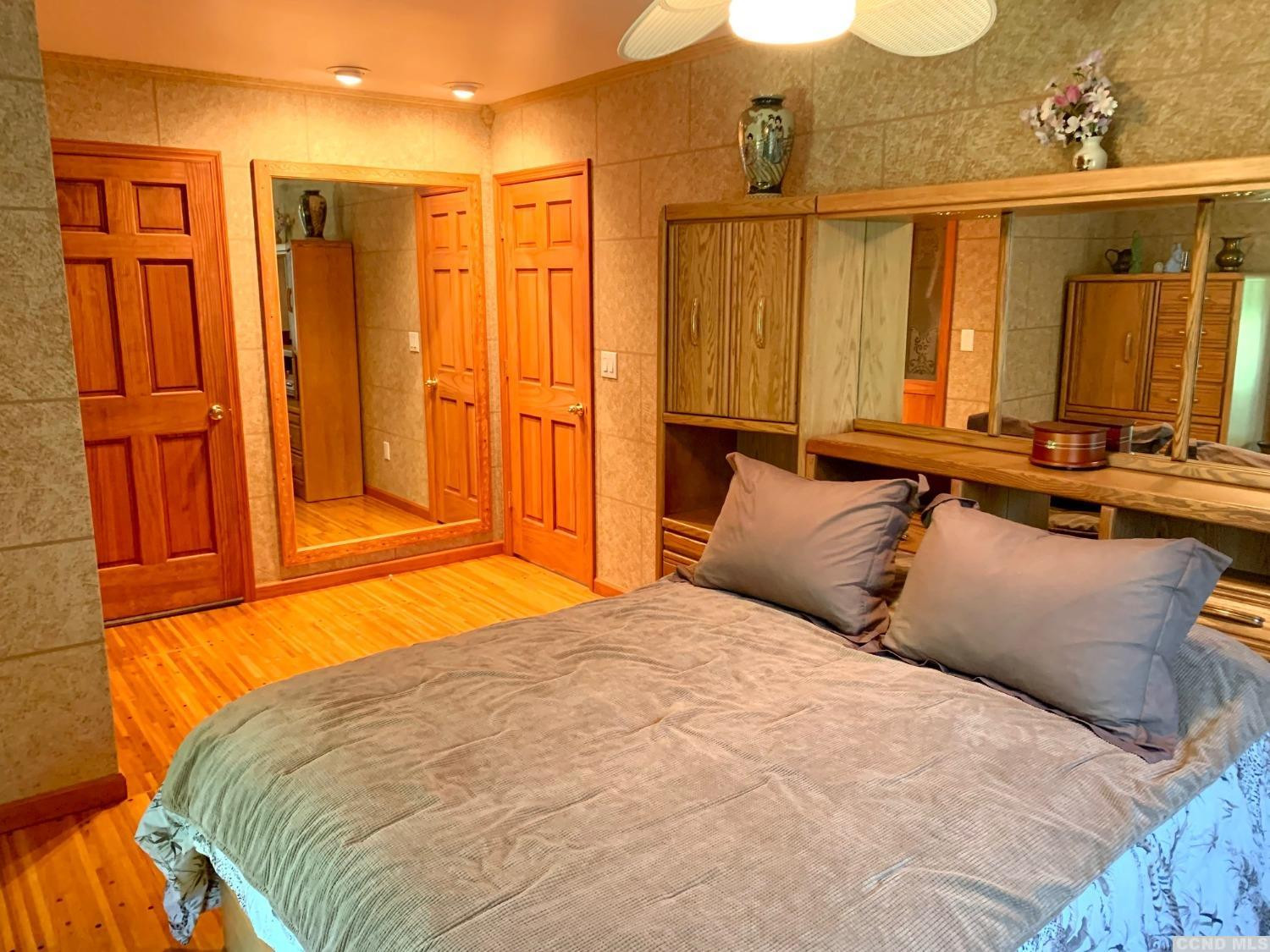 160 Willowbrook Road Hudson, NY 12534 - Photo 12 of 48 a bedroom with a bed a dresser and mirror