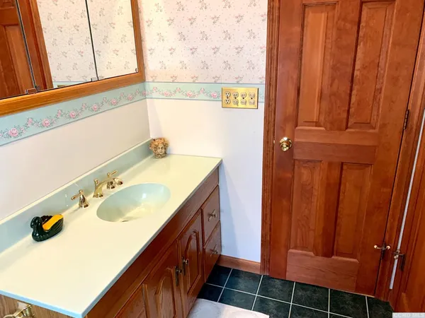 a bathroom with a sink and a mirror