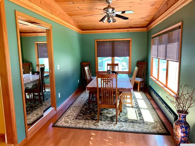 a view of a living room and dining room