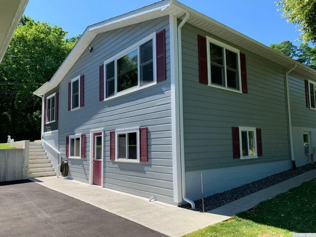 a front view of a house with garage