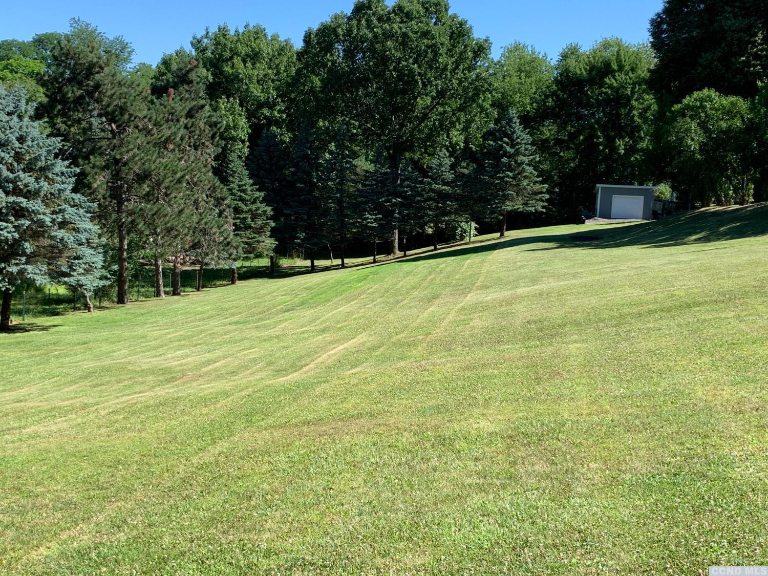 160 Willowbrook Road Hudson, NY 12534 - Photo 47 of 48 a swimming pool with trees in the background