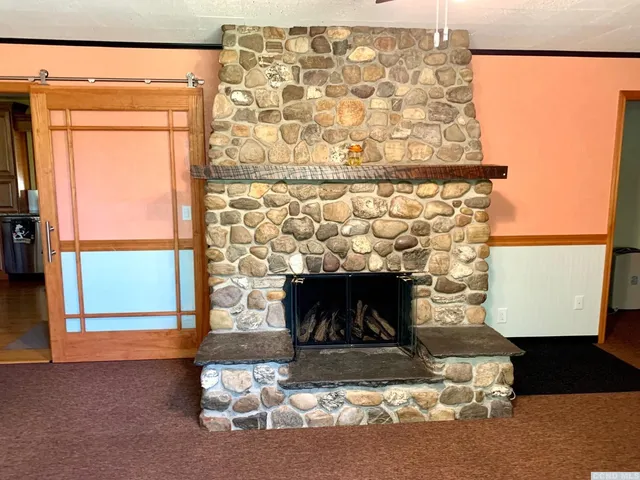 a living room with a fireplace