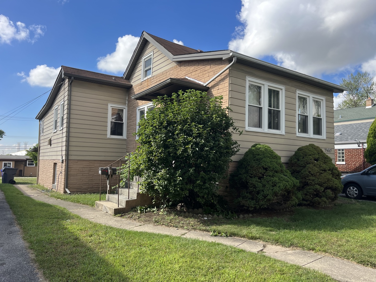 a front view of a house with garden