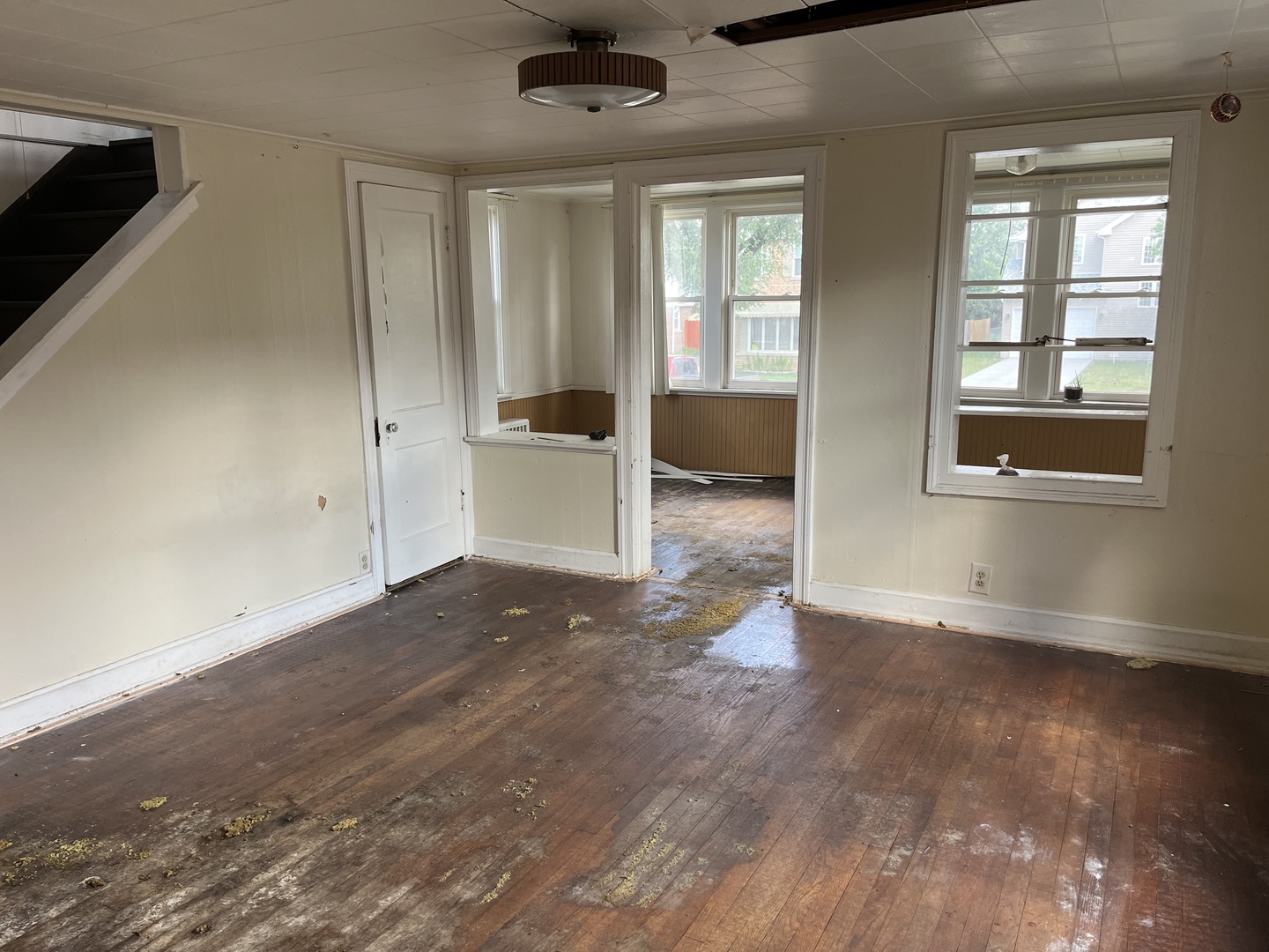 7907 46th Street Lyons, IL 60534 - Photo 8 of 17 an empty room with wooden floor and windows