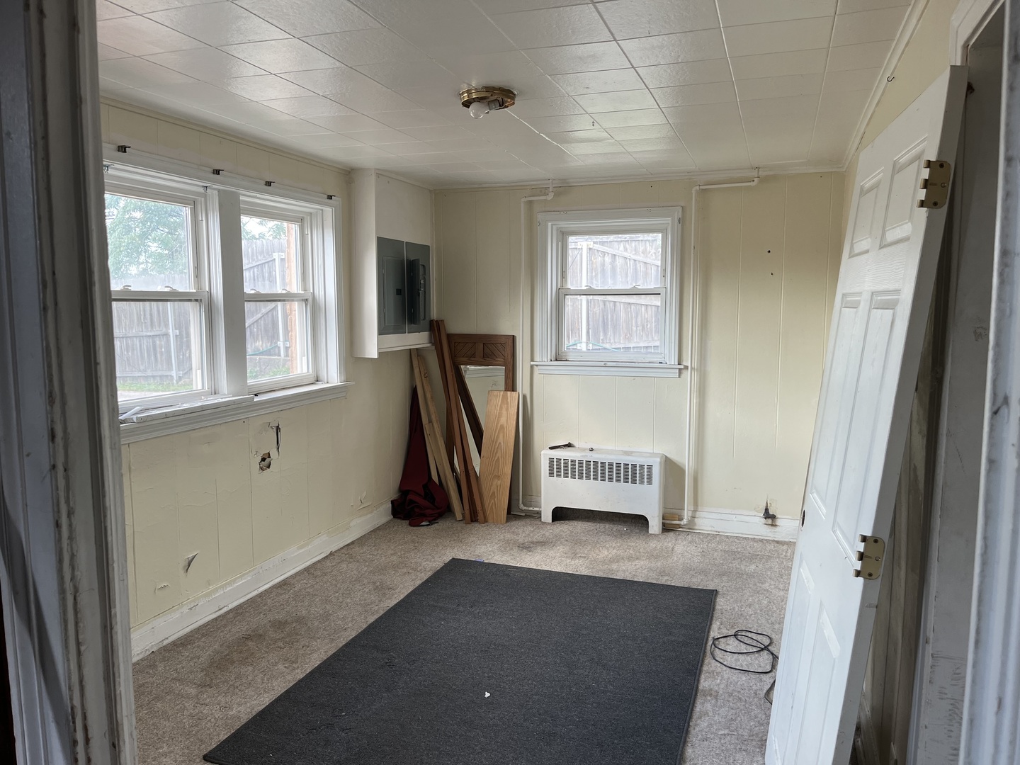 7907 46th Street Lyons, IL 60534 - Photo 9 of 17 a view of a bedroom with furniture and a window