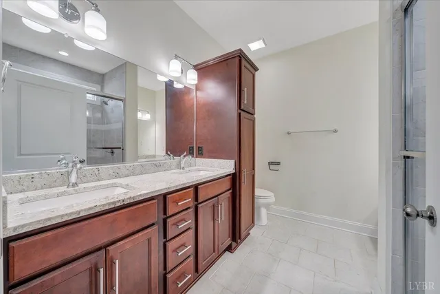 a bathroom with a glass shower door
