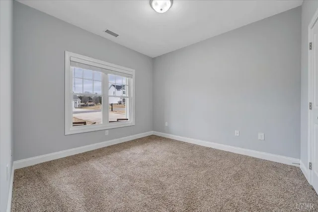 a view of a two chairs on the roof deck