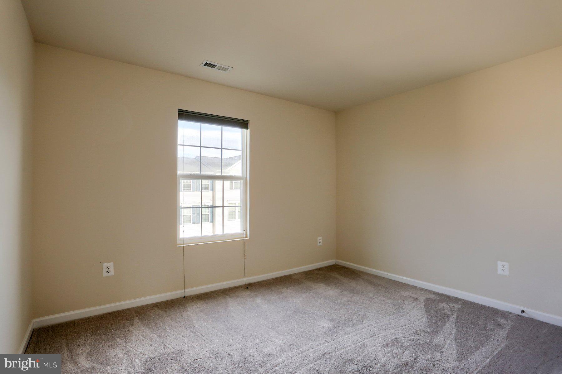 2465 Walnut Bottom Road, Unit 80 York, PA 17408 - Photo 23 of 36 an empty room with a window