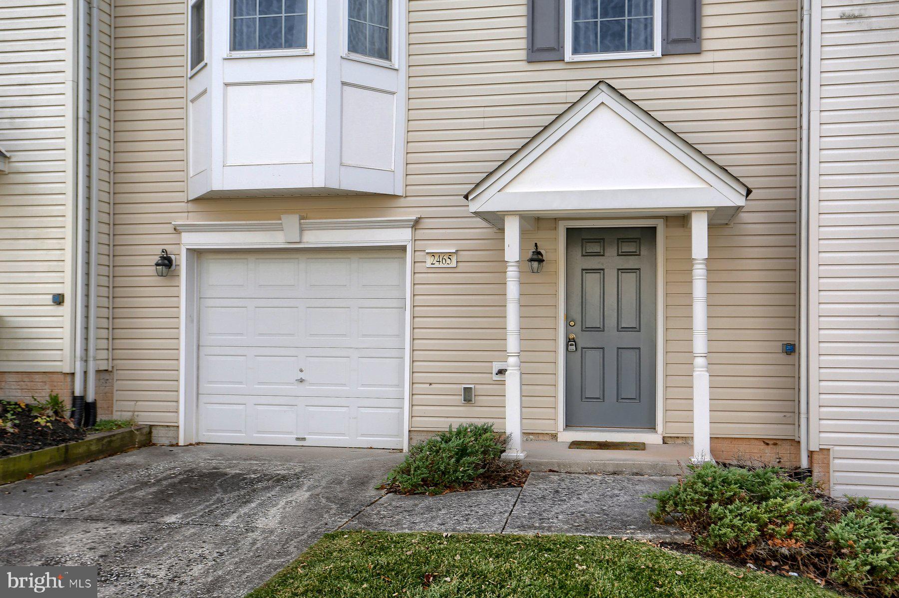 2465 Walnut Bottom Road, Unit 80 York, PA 17408 - Photo 3 of 36 a front view of a house with a yard and garage