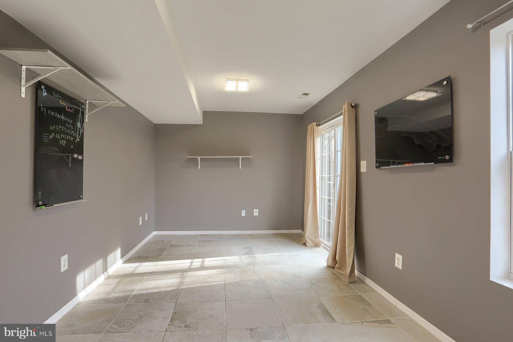 2465 Walnut Bottom Road, Unit 80 York, PA 17408 - Photo 8 of 36 a view of a livingroom with wooden floor and flat screen tv
