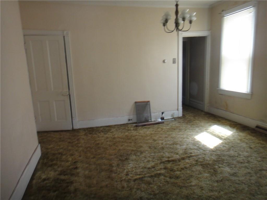 145 Main Street New Eagle, PA 15067 - Photo 12 of 24 a view of an empty room and chandelier fan