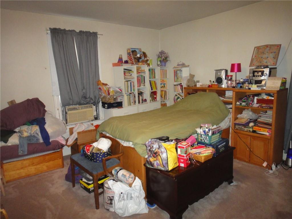 145 Main Street New Eagle, PA 15067 - Photo 17 of 24 a bed room with furniture and a flat screen tv