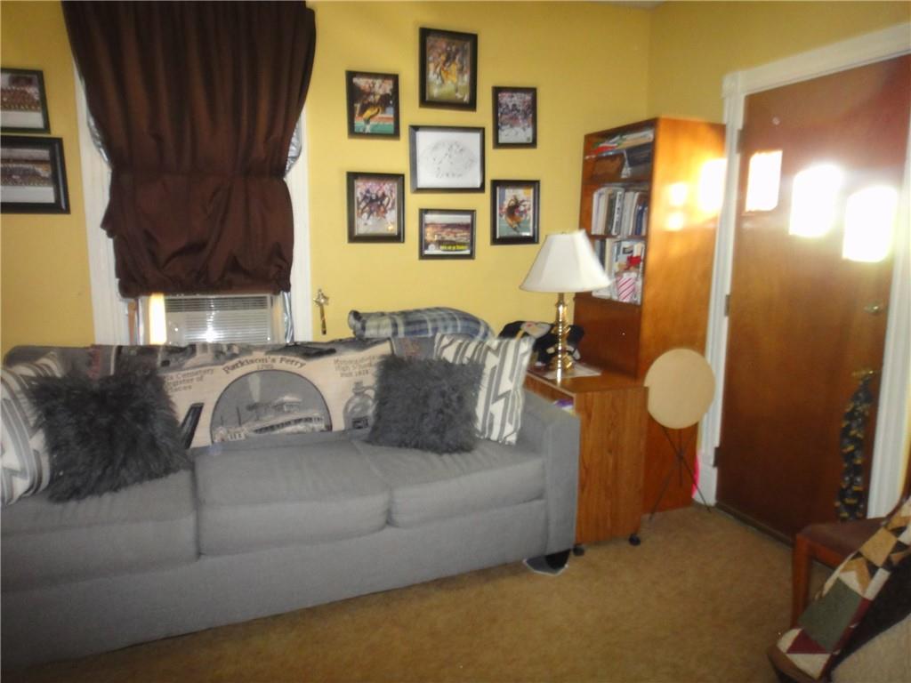 145 Main Street New Eagle, PA 15067 - Photo 3 of 24 a living room with furniture and a window