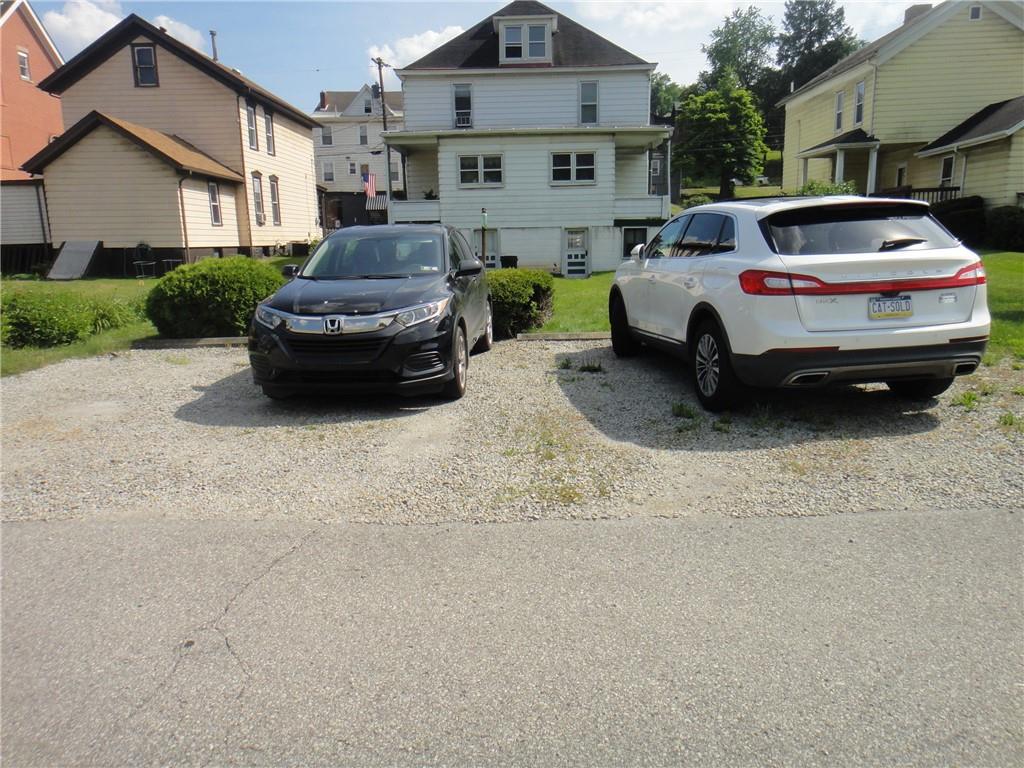 145 Main Street New Eagle, PA 15067 - Photo 6 of 24 a car parked in front of a house