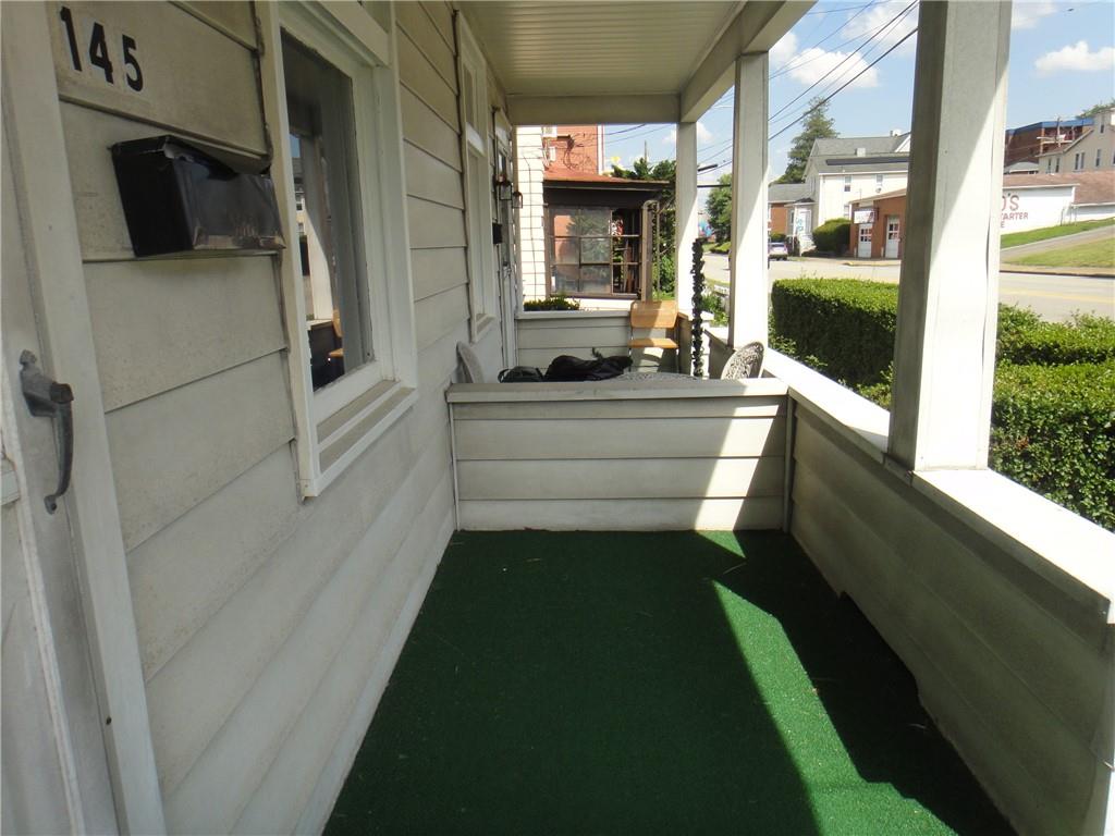 145 Main Street New Eagle, PA 15067 - Photo 8 of 24 a living room with a bed furniture and a large window