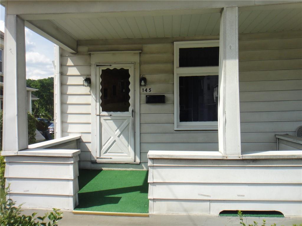 145 Main Street New Eagle, PA 15067 - Photo 9 of 24 a view of house with large windows and entryway