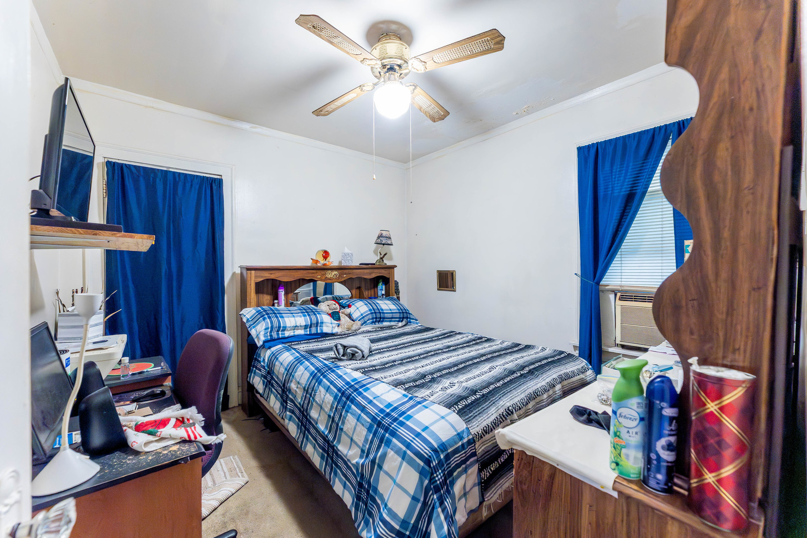 8129 South Cornell Avenue Chicago, IL 60617 - Photo 12 of 21 a bedroom with a bed and a chandelier
