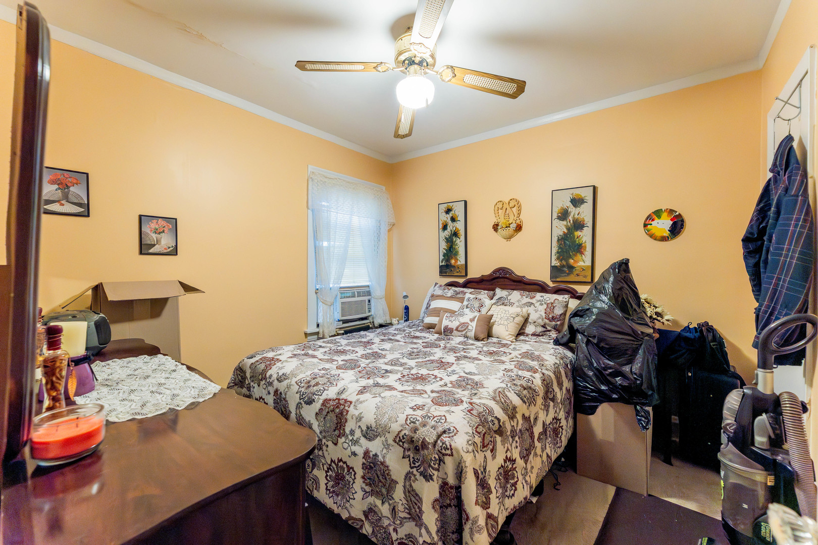 8129 South Cornell Avenue Chicago, IL 60617 - Photo 14 of 21 a bed room with a bed and a chandelier