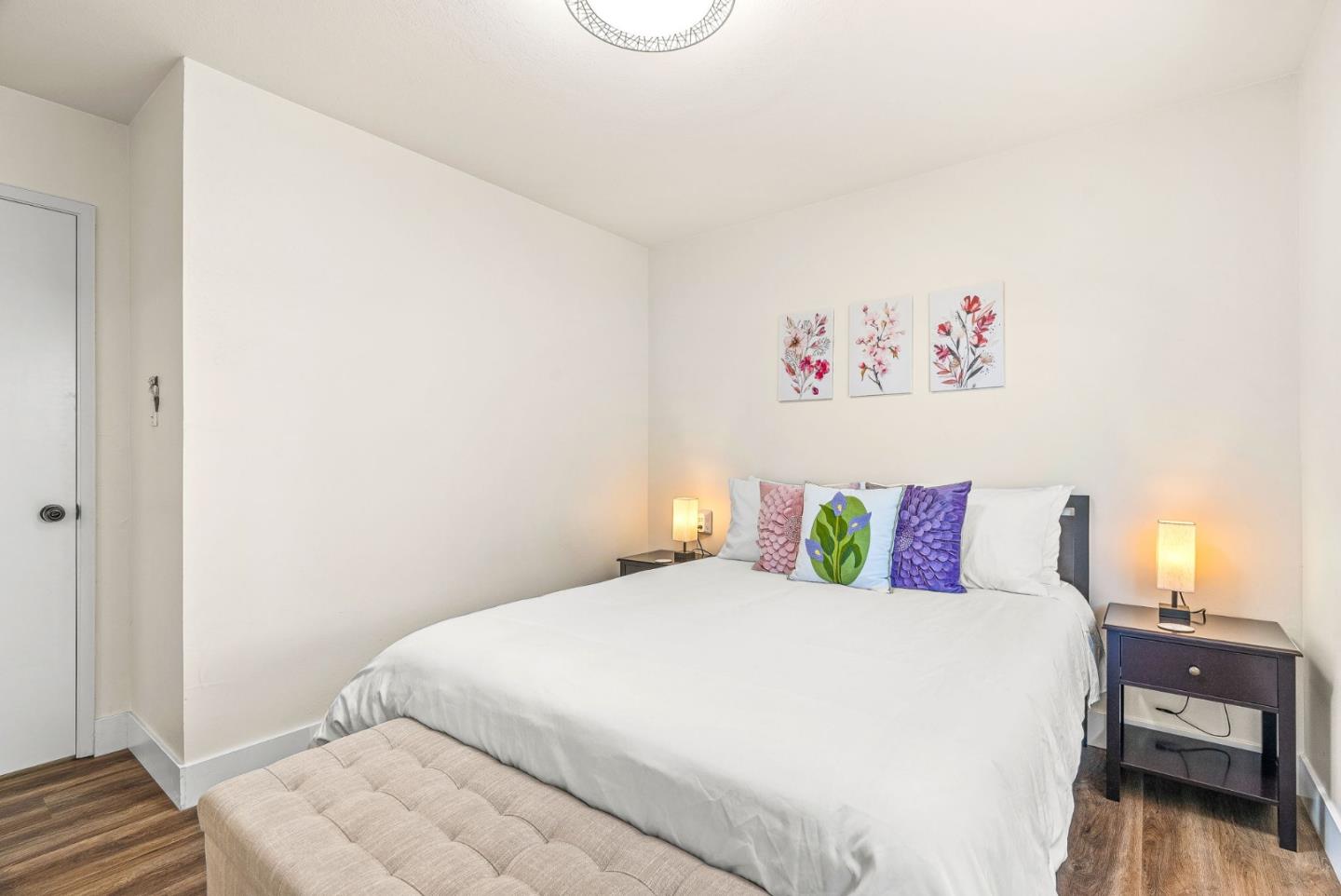 26372 Riverside Place Carmel, CA 93923 - Photo 14 of 35 a bedroom with a bed and a wooden floor