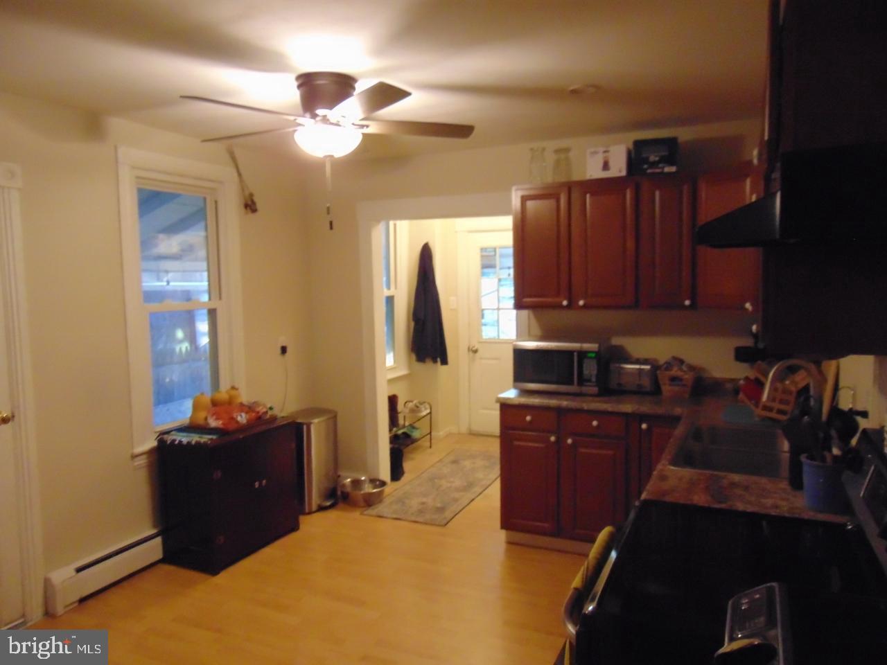 21 West Smith Street Topton, PA 19562 - Photo 16 of 31 a kitchen with granite countertop a refrigerator and a stove top oven