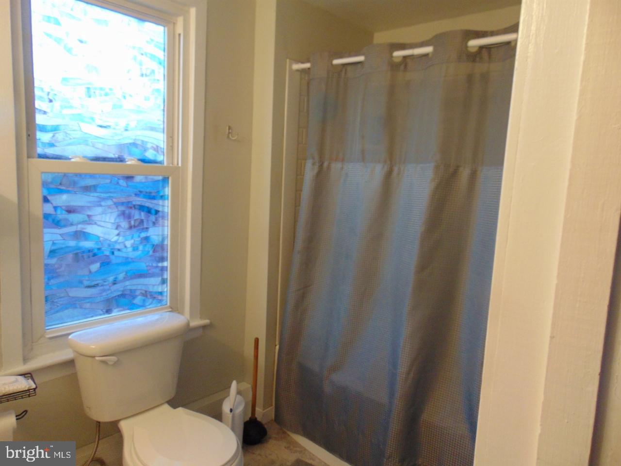 21 West Smith Street Topton, PA 19562 - Photo 28 of 31 a bathroom with a toilet and a shower