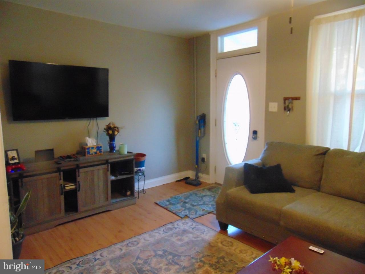 21 West Smith Street Topton, PA 19562 - Photo 10 of 31 a living room with furniture and a flat screen tv