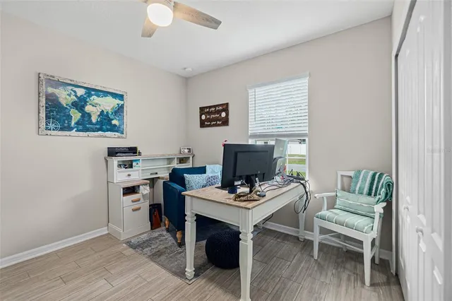 a workspace with furniture and wooden floor