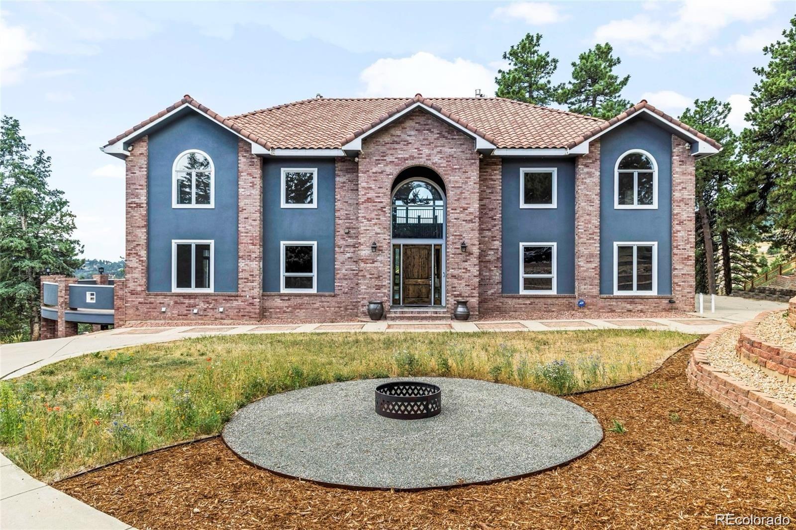 a view of a house with swimming pool and sitting area