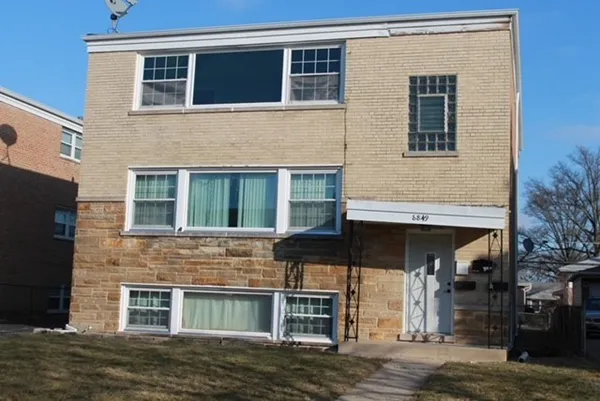 a view of a house with a parking space