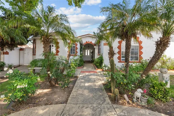 front view of a house with a garden