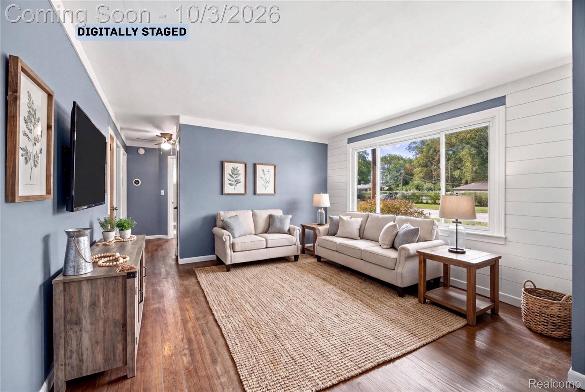 556 Henry Ruff Road Garden City, MI 48135 - Photo 8 of 49 Virtually Staged Wood-finish flooring, ample natural light from large window, white shiplap accent wall, and blue painted walls