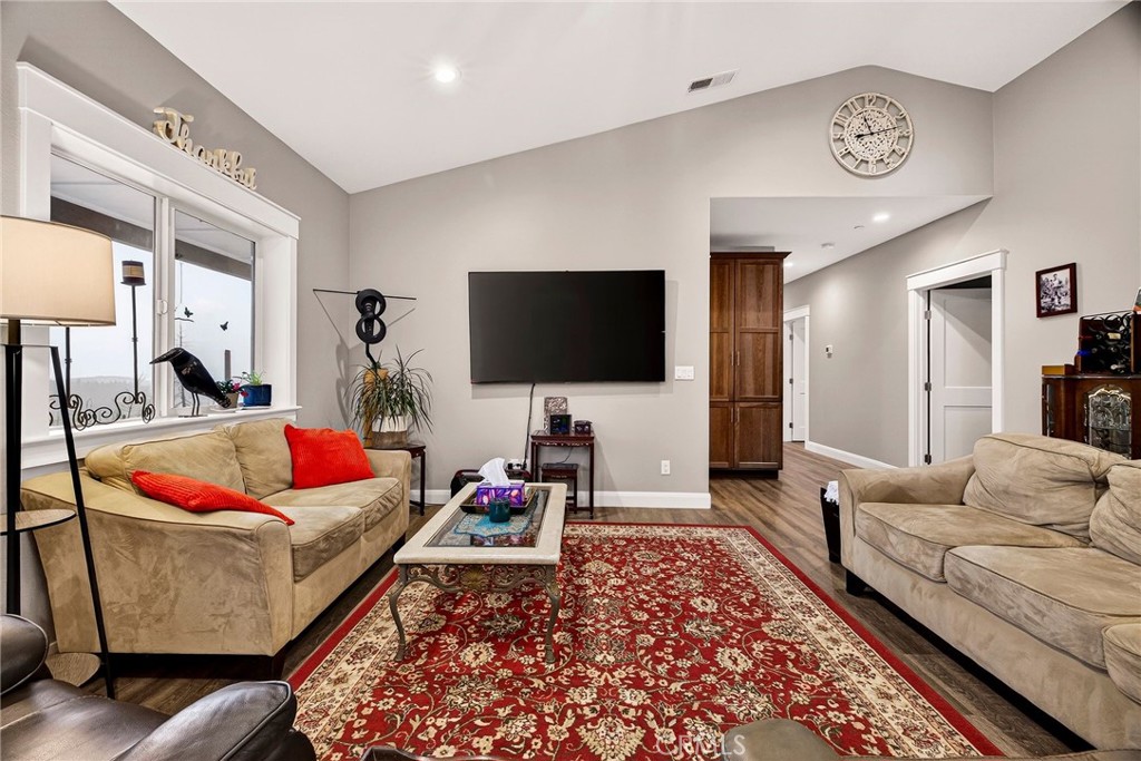 603 Zink Road Berry Creek, CA 95916 - Photo 12 of 69 a living room with furniture and a flat screen tv